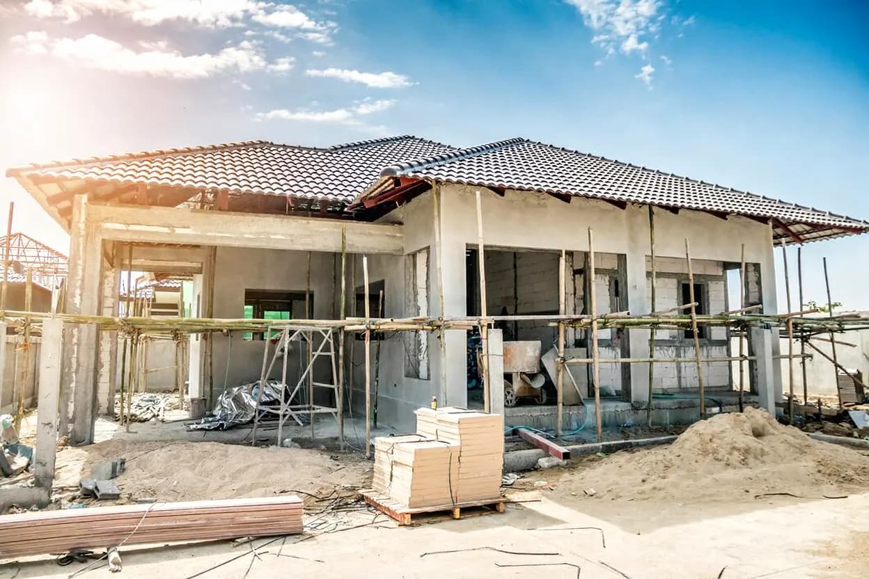Construction cost estimating consultant reviewing project plans