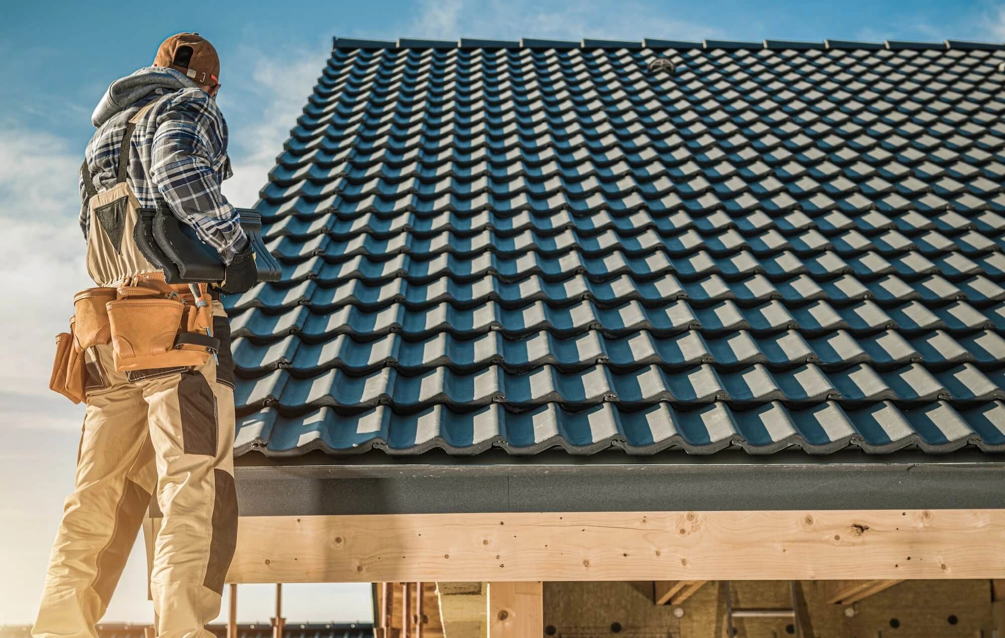 Construction professional on a roofing project — Grace Estimating services